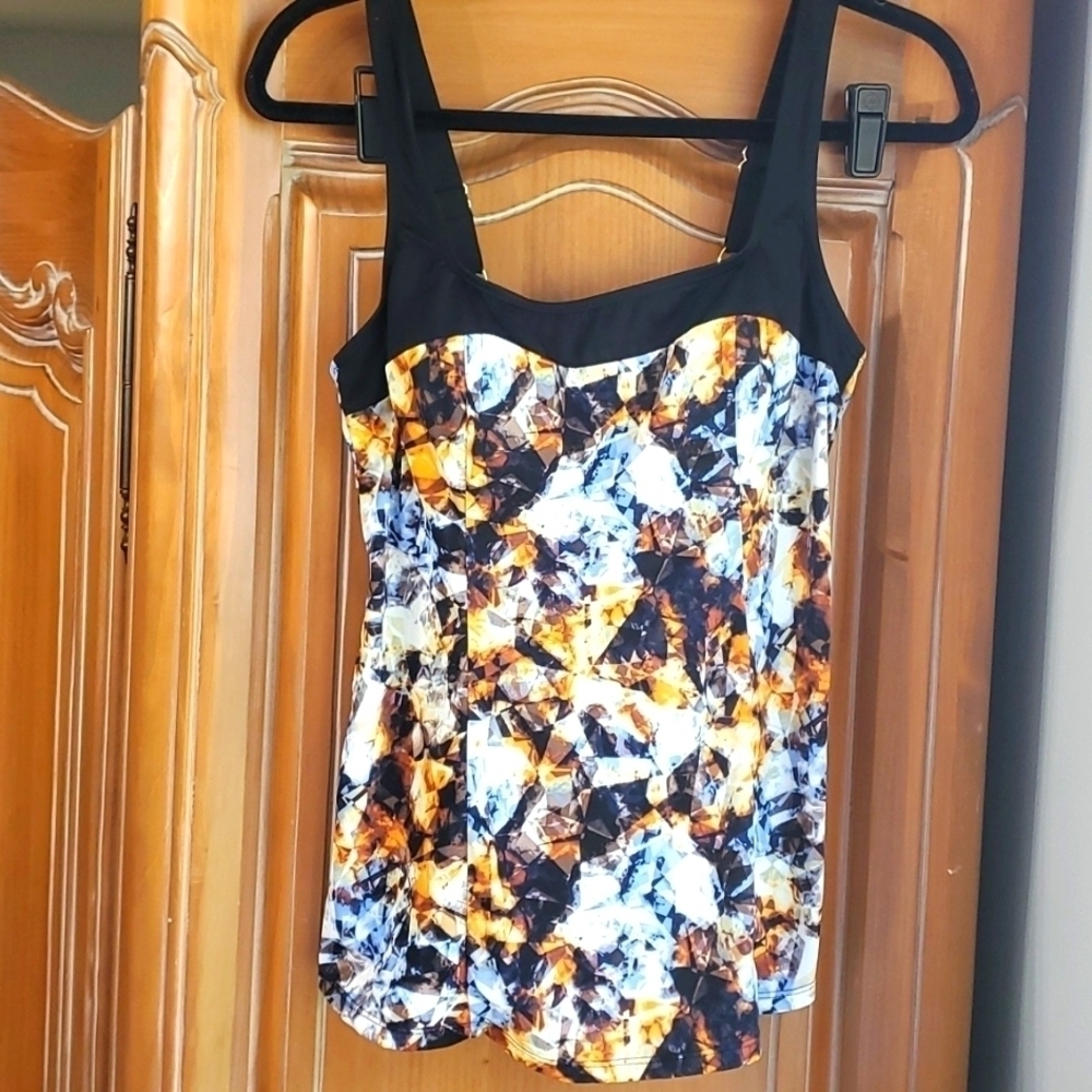 Fit 4 U. Bathing suit top.  Size 10. Great used condition. Fun colors. Comfy